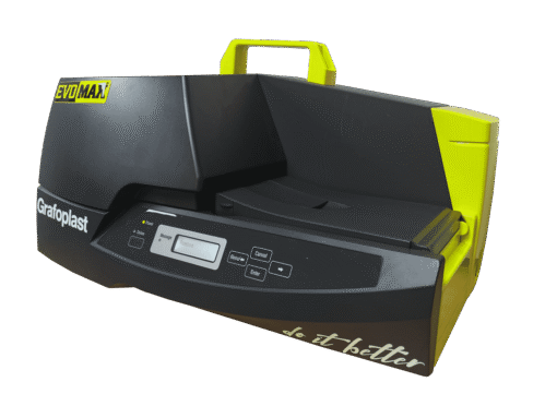 A black and yellow EVOMAX Thermal Printer with a digital display, control buttons, and top handle is shown alongside the KITMAX Automatic Feeder Kit for EVOMAX Thermal Printer, both isolated on a white background.